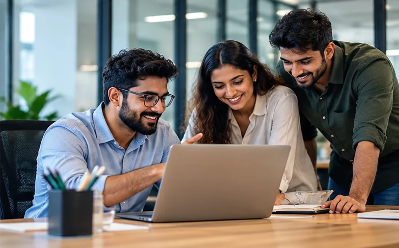Business team reviewing crypto settlements in INR on a laptop